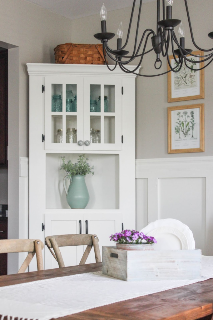 Have awkward corners in your home? Fill it with a charming and functional DIY corner cabinet. Click over to see more!
