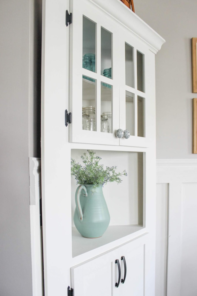 Have awkward corners in your home? Fill it with a charming and functional DIY corner cabinet. Click over to see more!