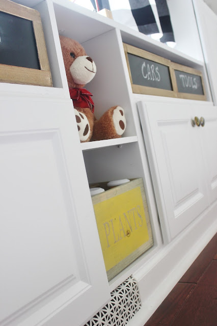 DIY built-in with decked out stock cabinets. What a terrific way to add stylish and functional storage to a room! Step-by-step tutorial included.