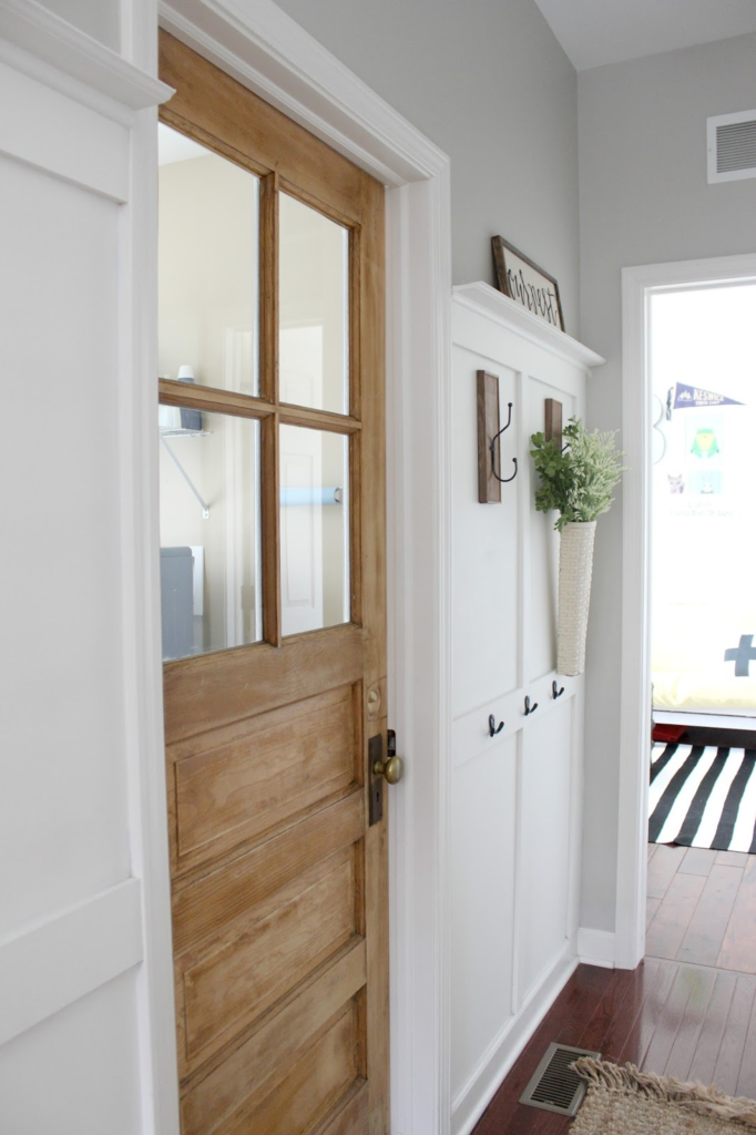 Wow! Replacing a standard laundry room door with an old, vintage door adds so much character and charm!