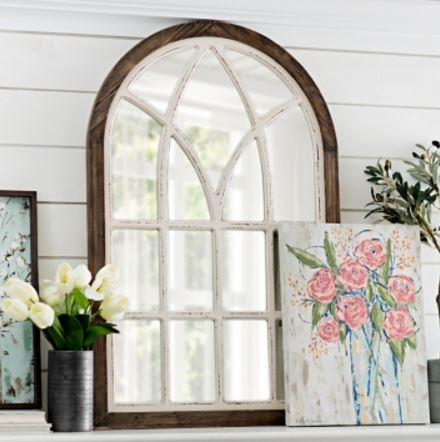 Take an old, thrift store mirror and turn it into a beautiful vintage-inspired wooden arched window frame