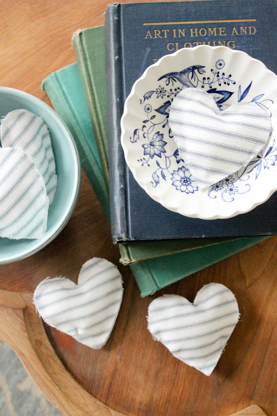 Farmhouse inspired Valentine's Day decor! Make these simple no-sew fabric hearts.