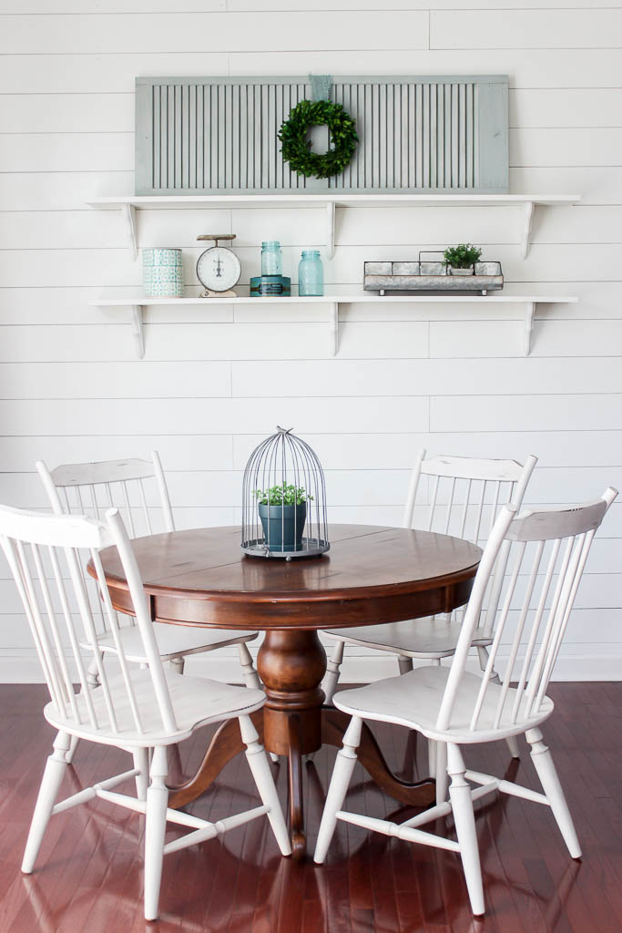 DIY white-painted shelves help create an airy vibe in this kitchen ear-in. Perfect for showing off Vintage finds.